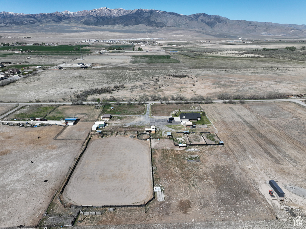 Drone / aerial view featuring a desert view, a mountain view, and a rural view