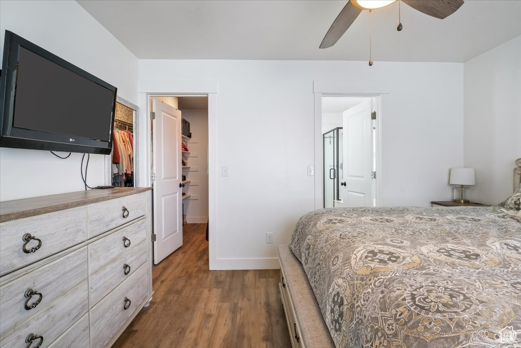 Bedroom with baseboards, ceiling fan, and wood finished floors