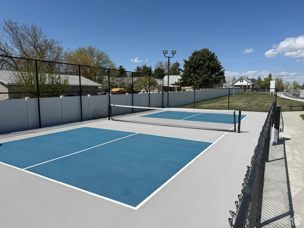 View of tennis court with fence