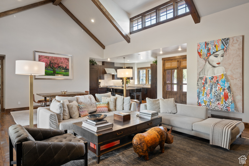 Living room with recessed lighting, beamed ceiling, wood finished floors, and high vaulted ceiling