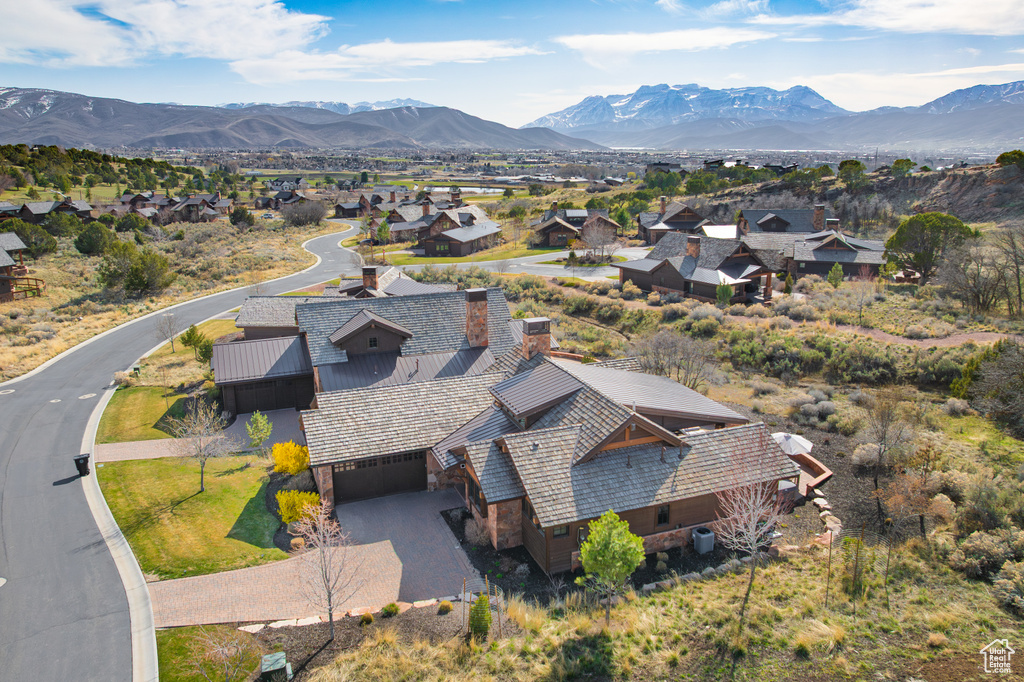 Birds eye view of property featuring a mountain view and a residential view