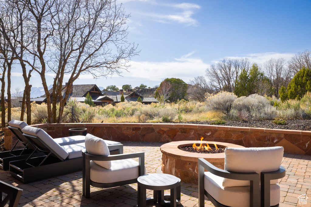 View of patio featuring a fire pit