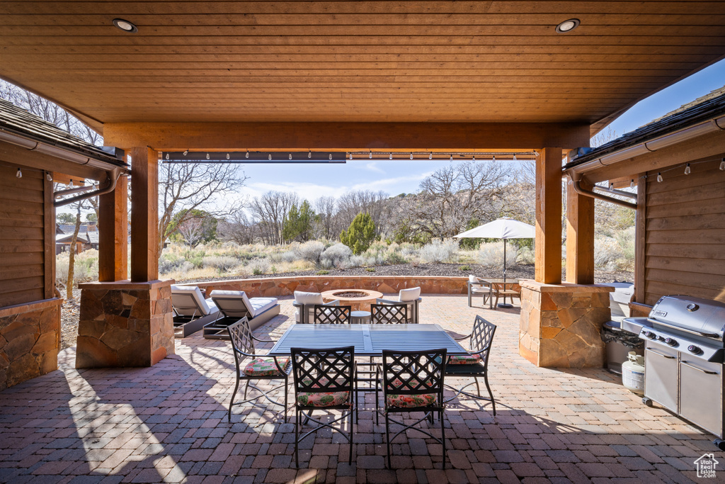 View of patio / terrace with a grill and outdoor dining space