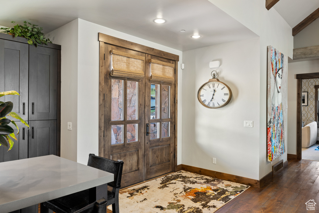 Foyer entrance with recessed lighting, baseboards, dark wood finished floors, and visible vents