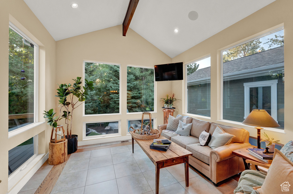Sunroom featuring a wealth of natural light and beam ceiling