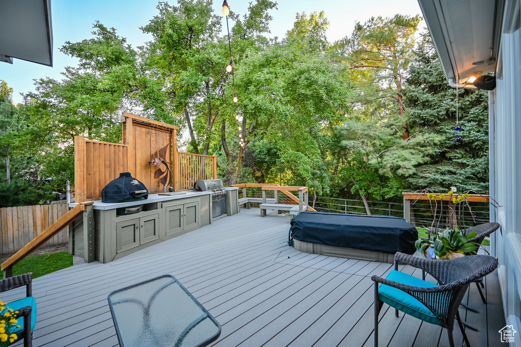 Wooden terrace with fence and area for grilling