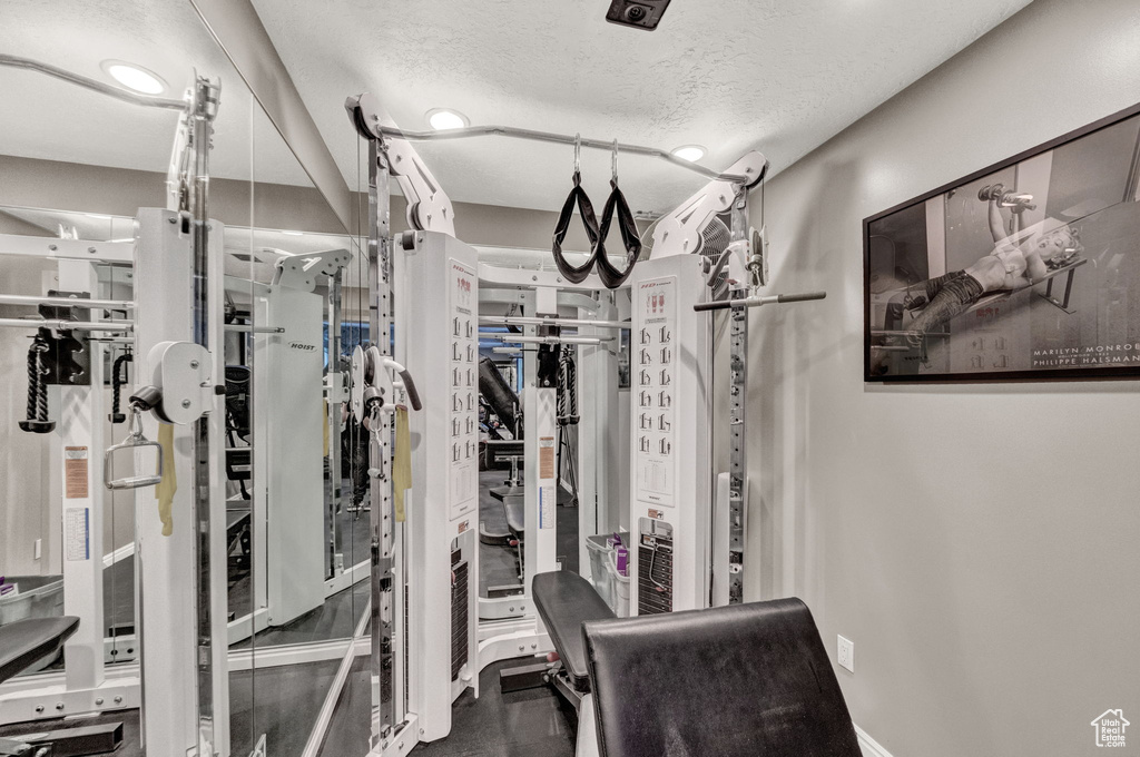 Exercise room with a textured ceiling
