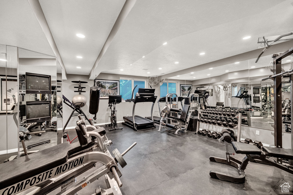 Workout area with recessed lighting and baseboards