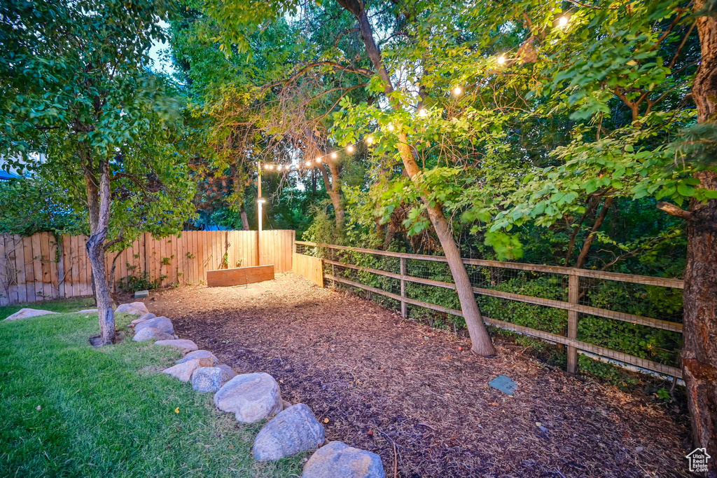 View of yard featuring fence