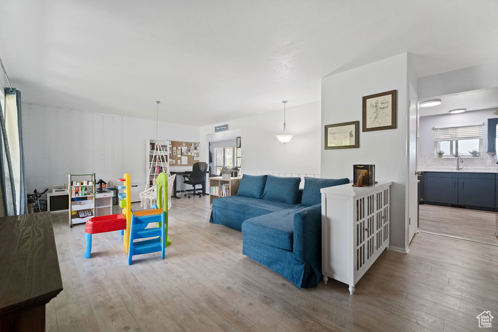 Living room with plenty of natural light and light wood finished floors