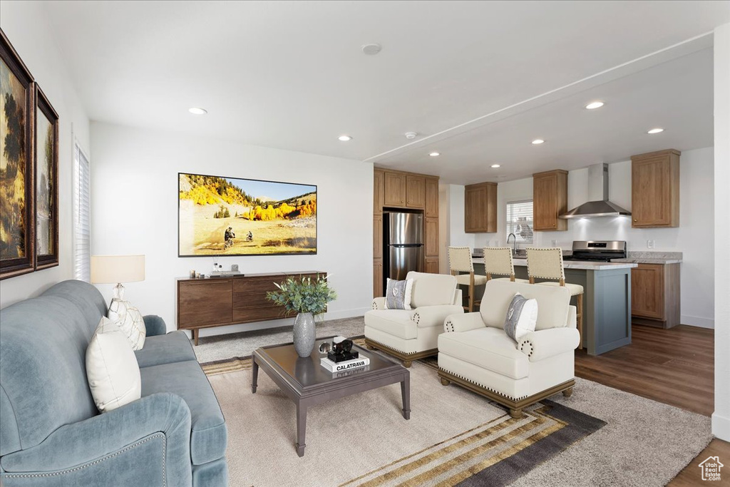 Living area featuring recessed lighting, baseboards, and wood finished floors
