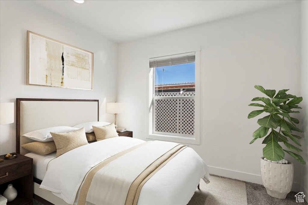 Carpeted bedroom with baseboards