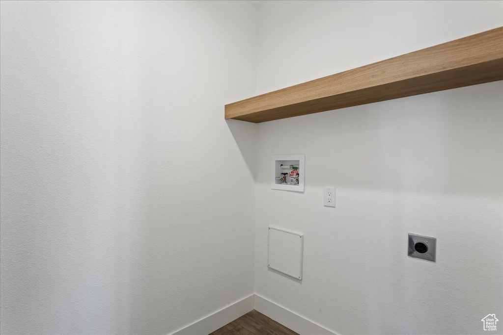 Washroom with laundry area, baseboards, hookup for a washing machine, electric dryer hookup, and dark wood finished floors