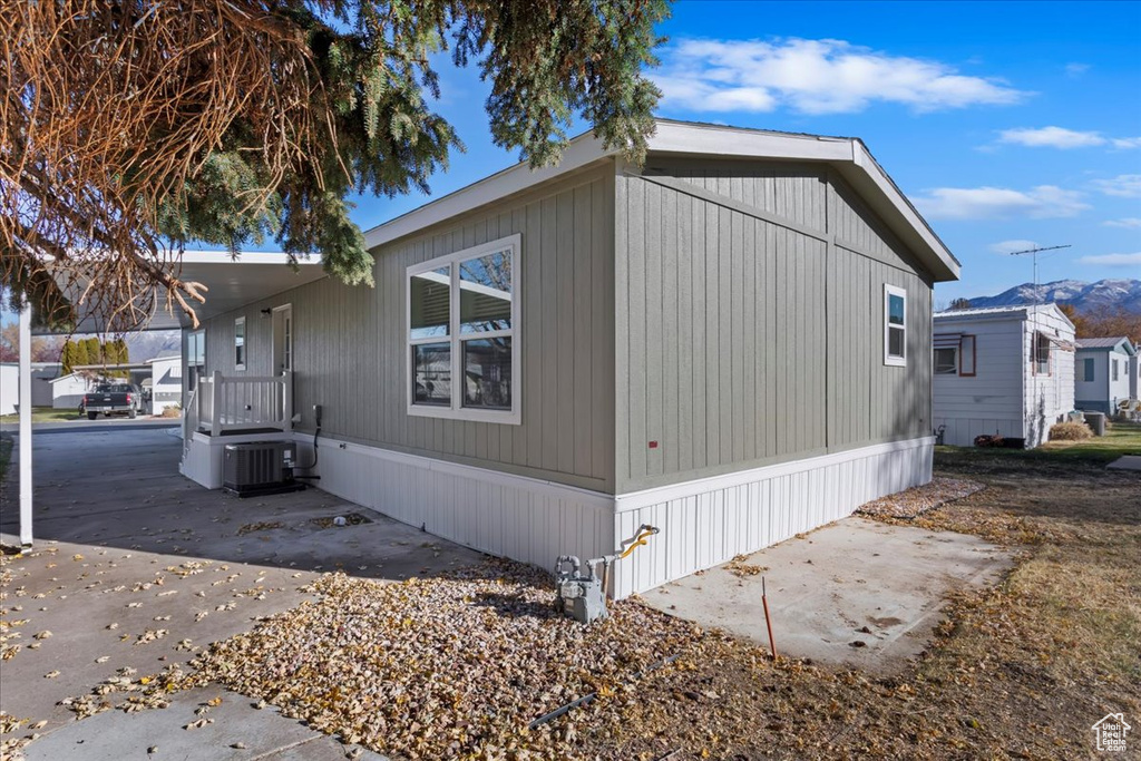 View of property exterior featuring central air condition unit and a patio