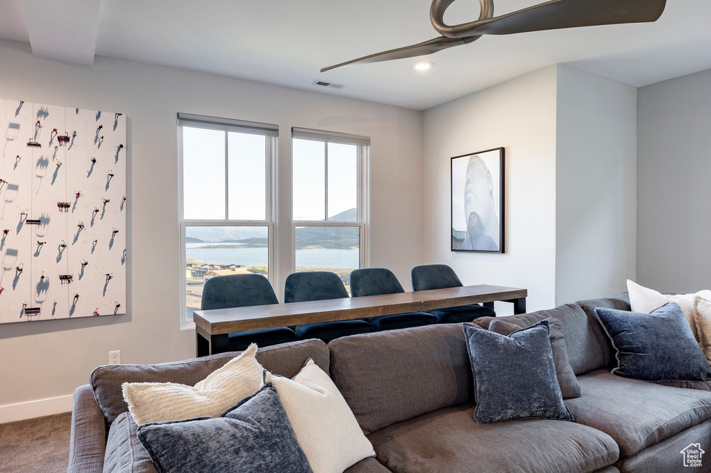 Living room featuring carpet flooring, a ceiling fan, baseboards, recessed lighting, and visible vents