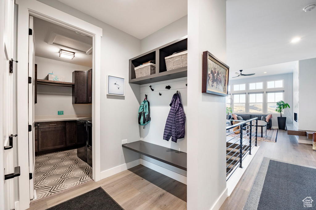Mudroom with baseboards and light wood finished floors