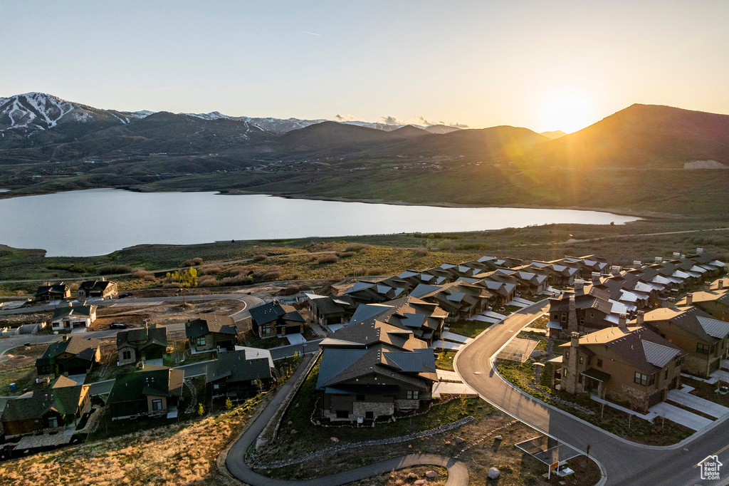 Drone / aerial view with a residential view and a water and mountain view
