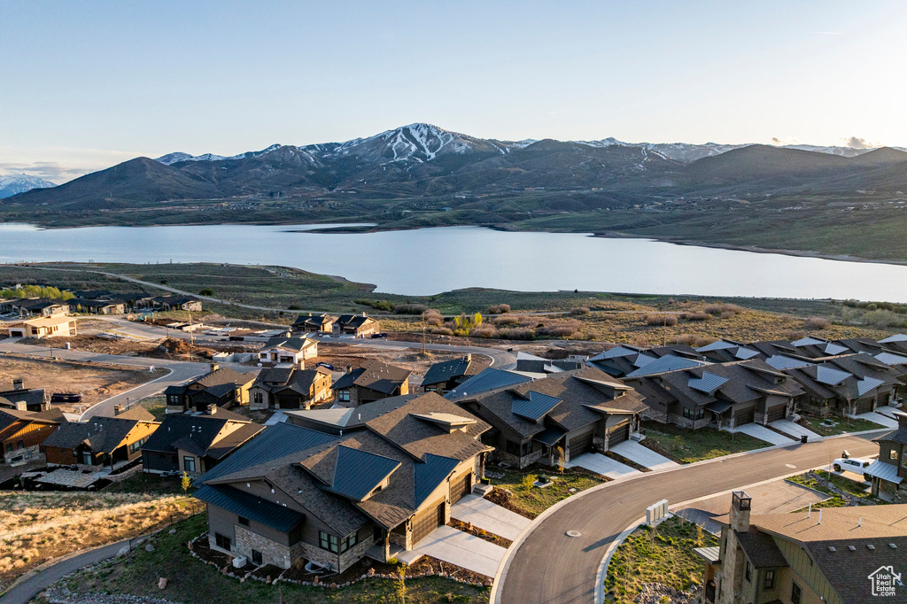 Drone / aerial view featuring a residential view and a water and mountain view
