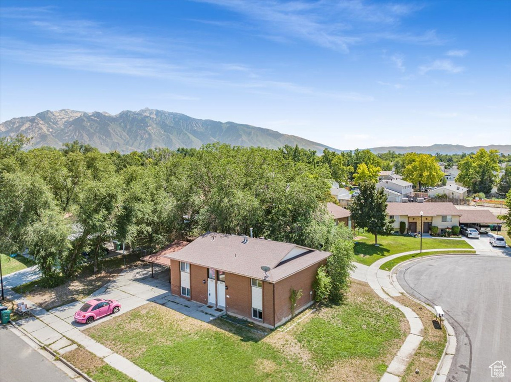 Birds eye view of property with a mountain view