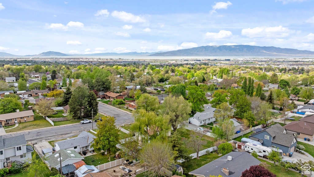 Drone / aerial view with a residential view and a mountain view