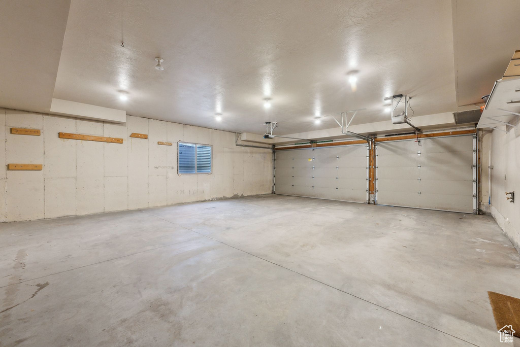 Garage featuring a garage door opener