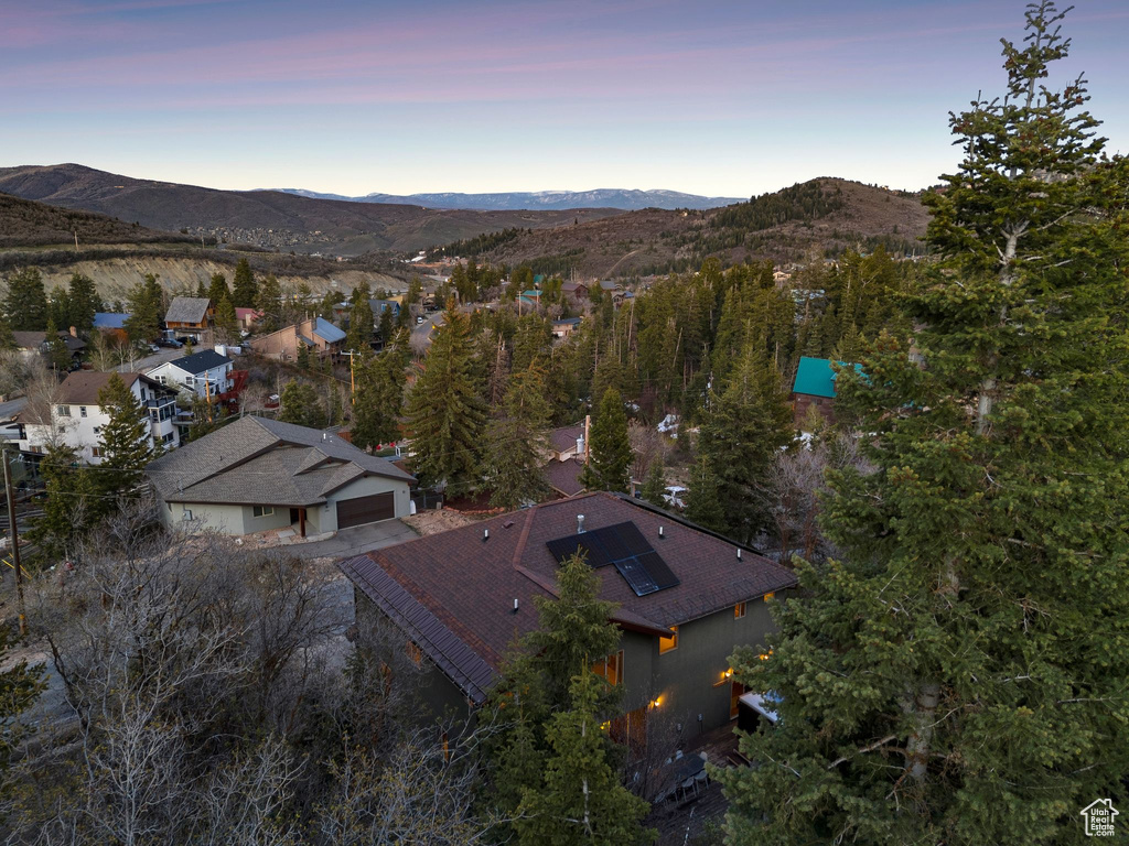 Aerial view at dusk featuring a mountain view