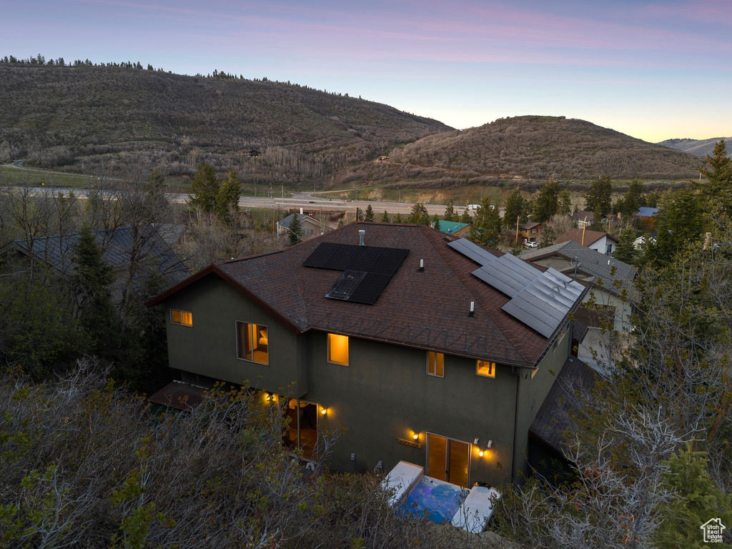 Aerial view at dusk featuring a mountain view
