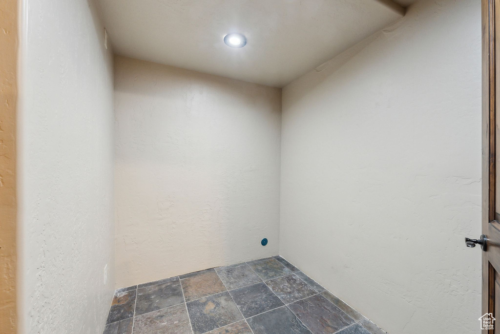 Laundry area with stone finish floor