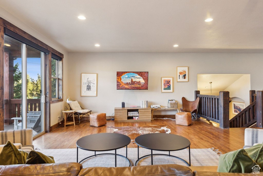 Living area featuring recessed lighting, baseboards, and wood finished floors