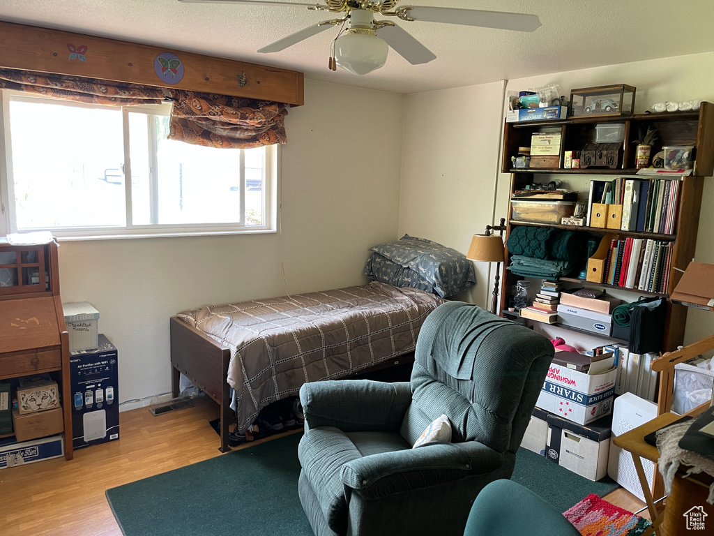 Bedroom featuring a ceiling fan and wood finished floors