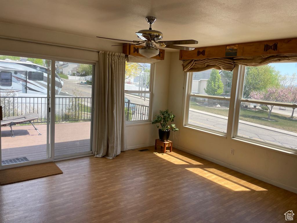 Unfurnished sunroom featuring visible vents