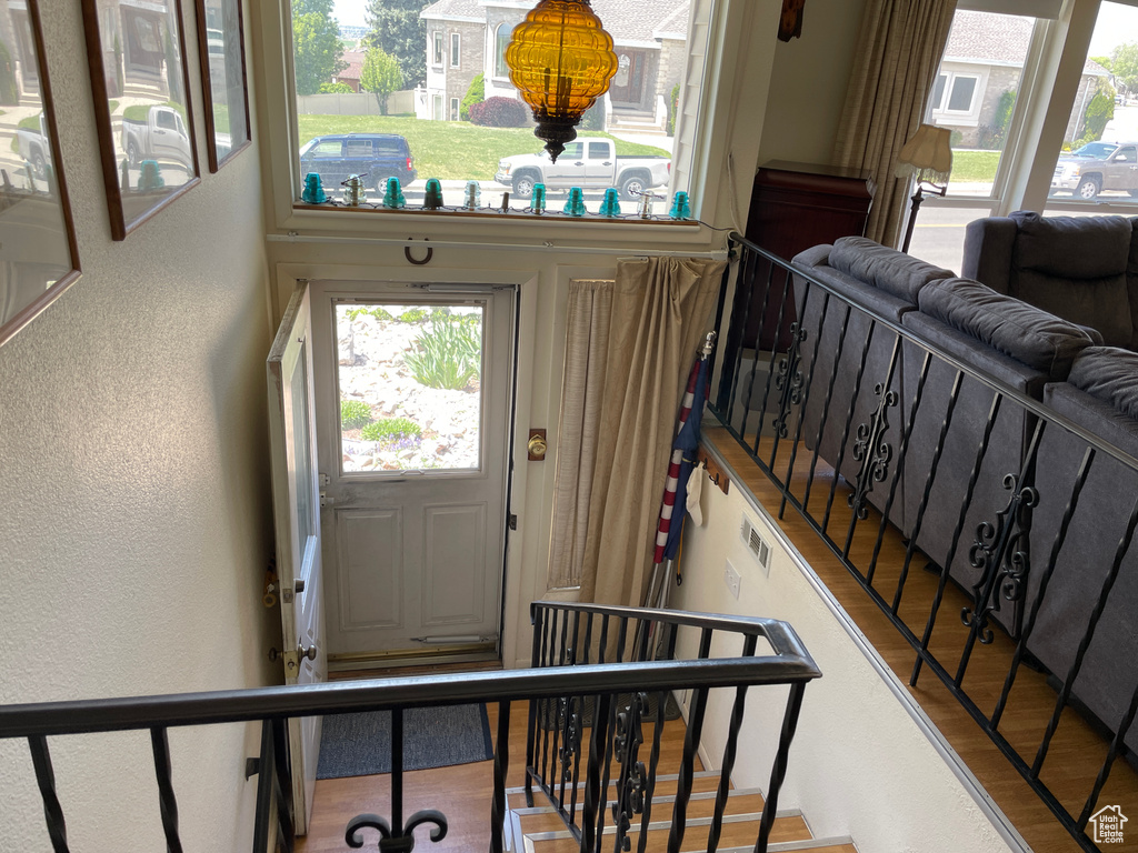 Foyer featuring a textured wall and stairs