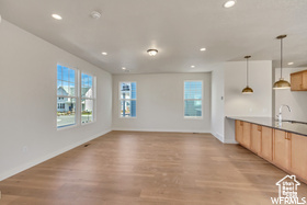 Kitchen featuring light wood-style floors, light brown cabinetry, plenty of natural light, and recessed lighting