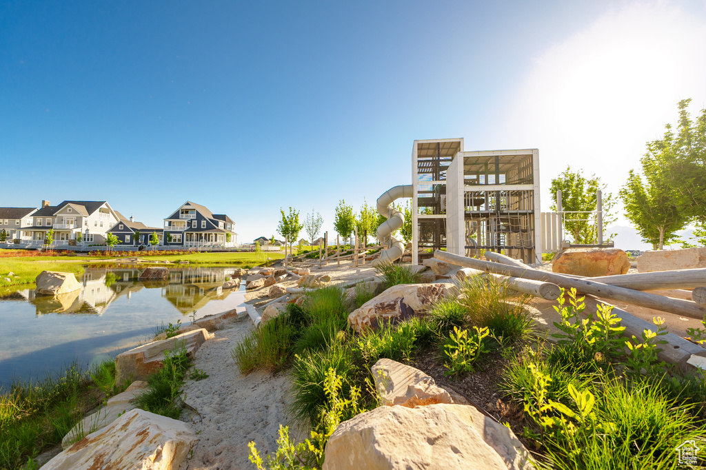 View of community featuring a water view