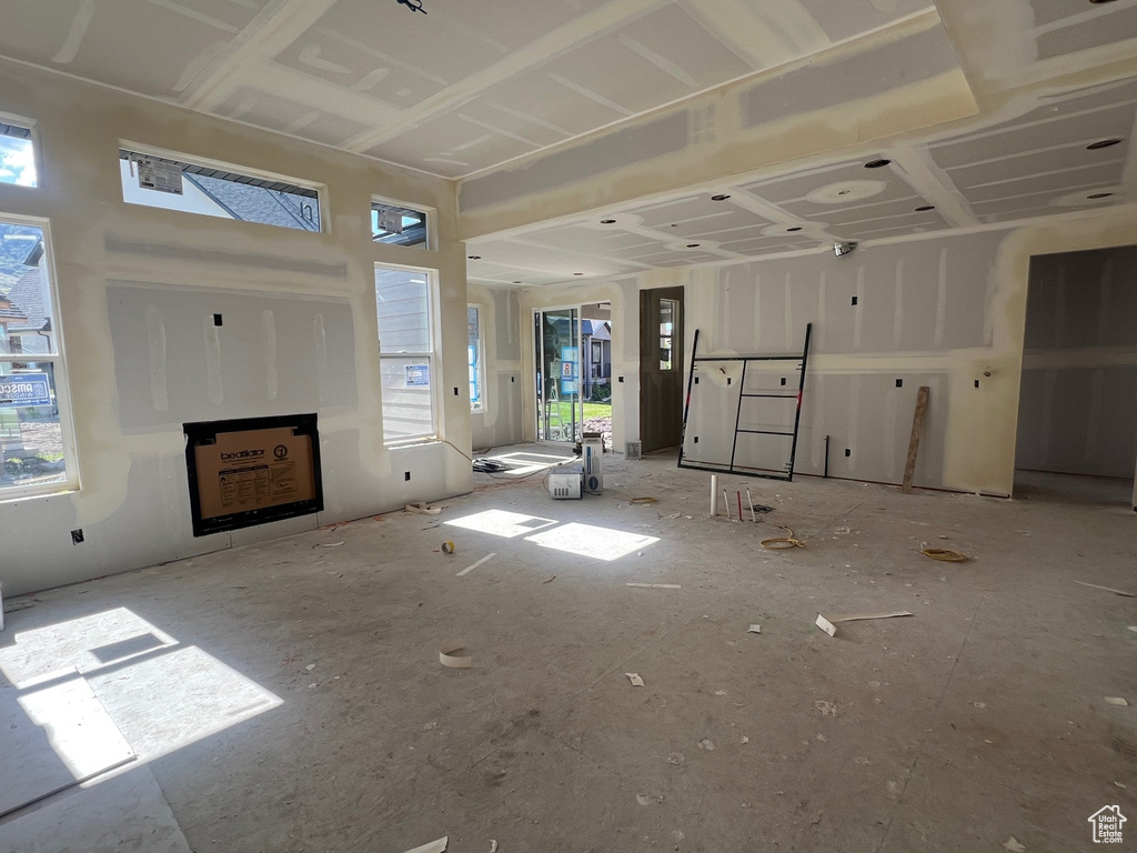 Unfurnished living room with plenty of natural light