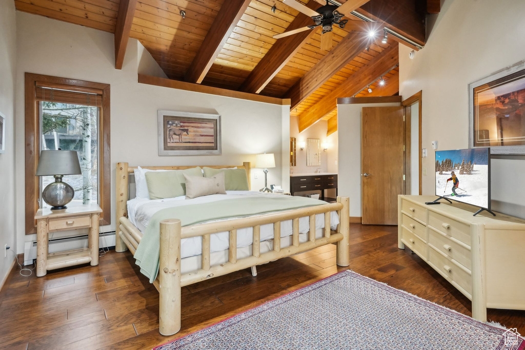 Bedroom featuring dark wood finished floors, a baseboard heating unit, wooden ceiling, and lofted ceiling with beams