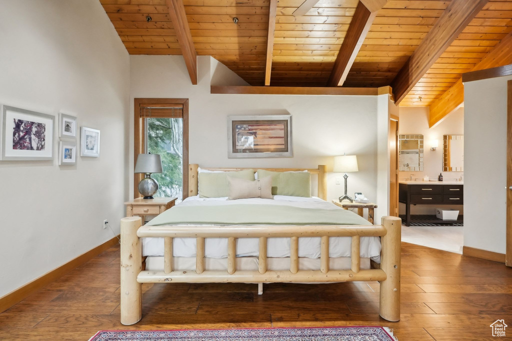 Bedroom with hardwood / wood-style floors, baseboards, and wood ceiling