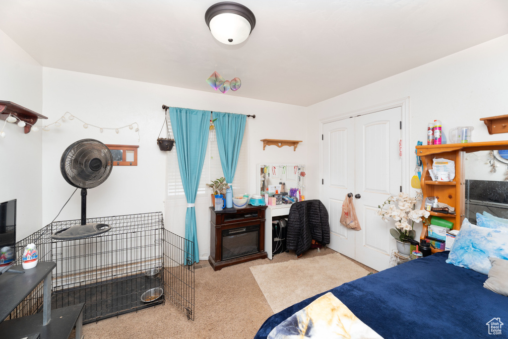 Bedroom with carpet and a closet