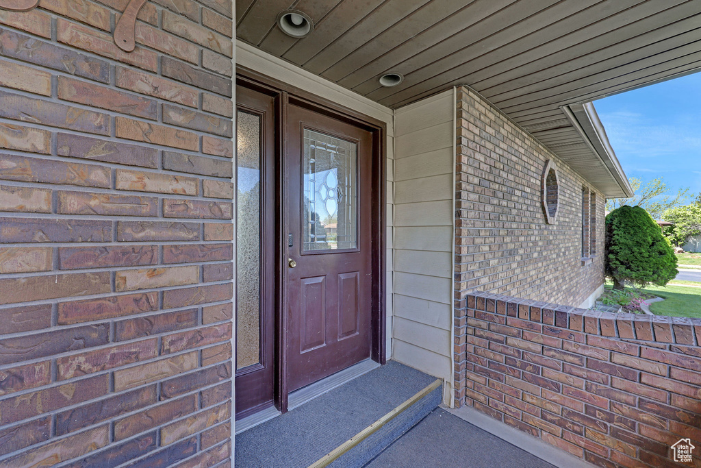 Property entrance with brick siding
