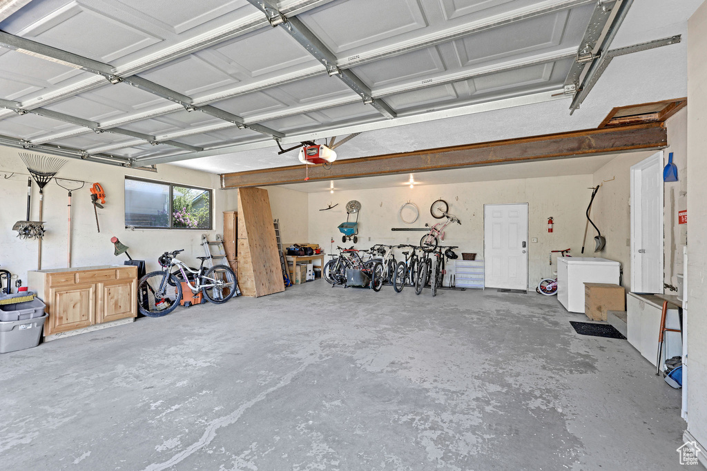 Garage with fridge and a garage door opener
