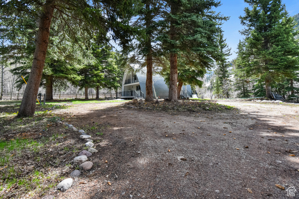 View of yard featuring fence
