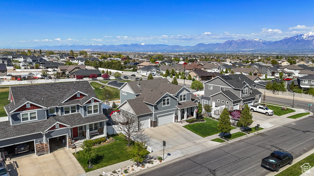 Birds eye view of property featuring a mountain view and a residential view