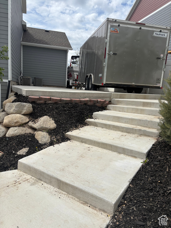 Exterior space featuring central AC and entry steps