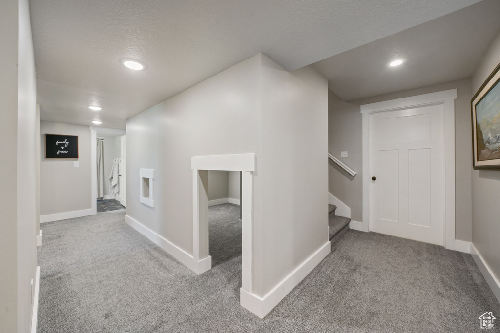 Hall with baseboards, carpet flooring, and recessed lighting