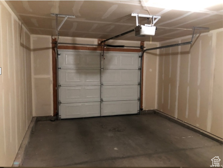 Garage featuring a garage door opener