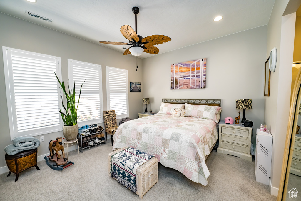Carpeted bedroom with visible vents, recessed lighting, baseboards, and ceiling fan