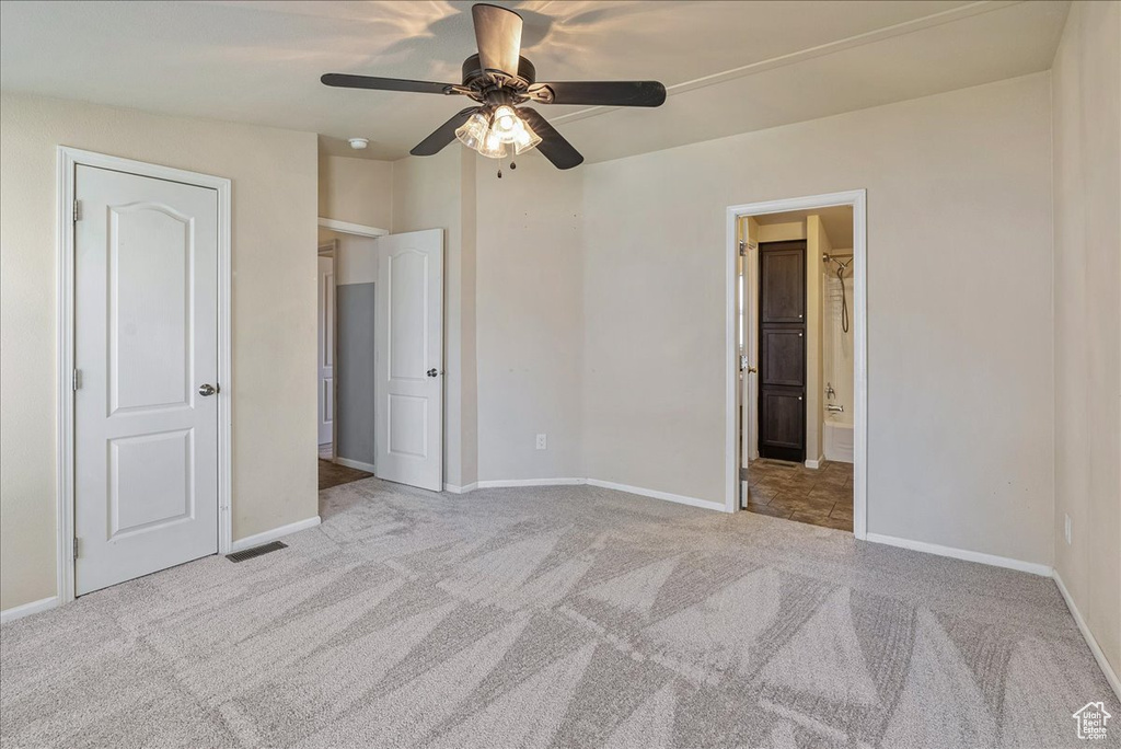 Unfurnished bedroom featuring carpet floors, baseboards, and visible vents