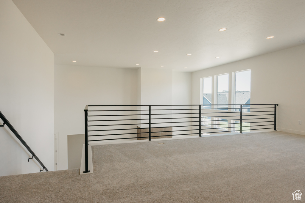 Empty room featuring carpet flooring and recessed lighting