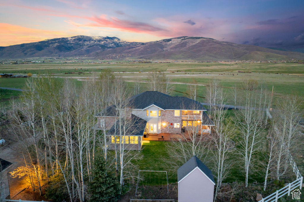 Property view of mountains with a rural view