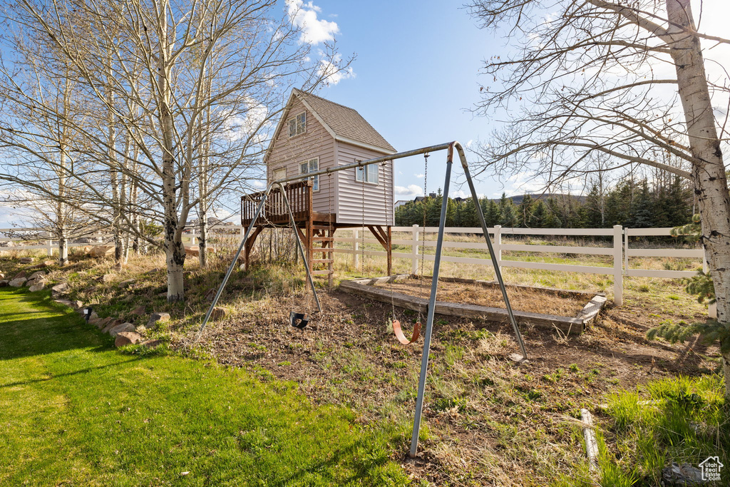 View of yard featuring fence